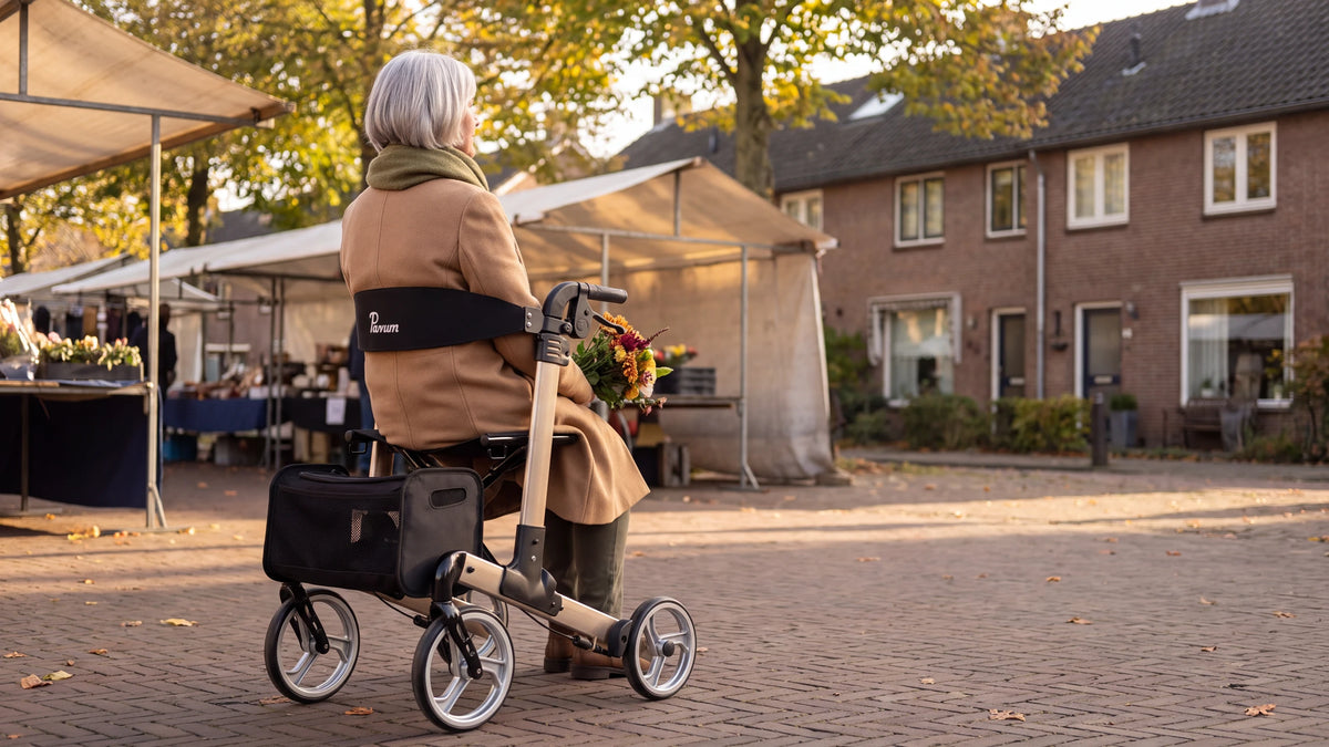Parvum Luxo in champagne at the edge of a market; a woman sits on the rollator and looks out over the stalls.